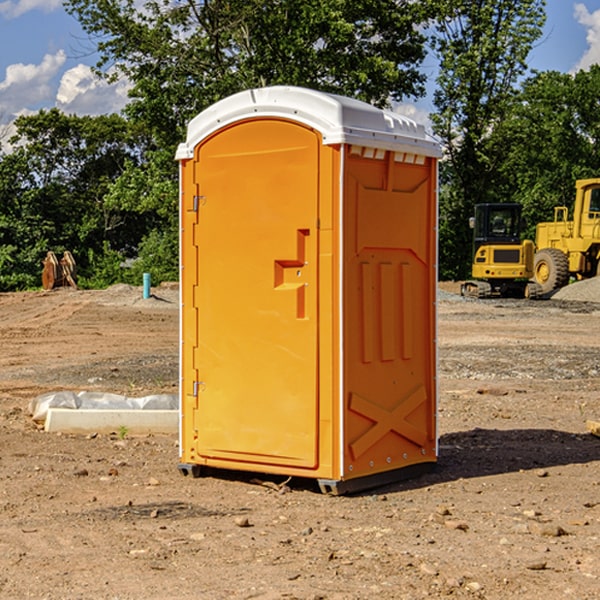 what is the cost difference between standard and deluxe portable restroom rentals in Bloomer